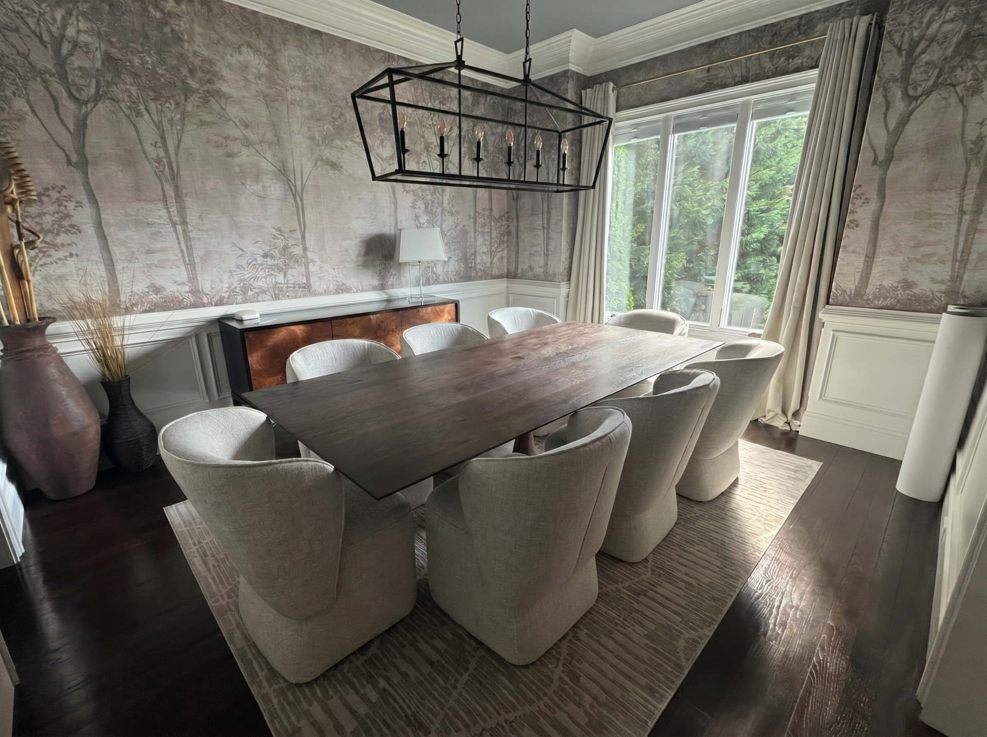 Muted forest mural wallpaper installed in a formal dining room in Sandy Springs GA