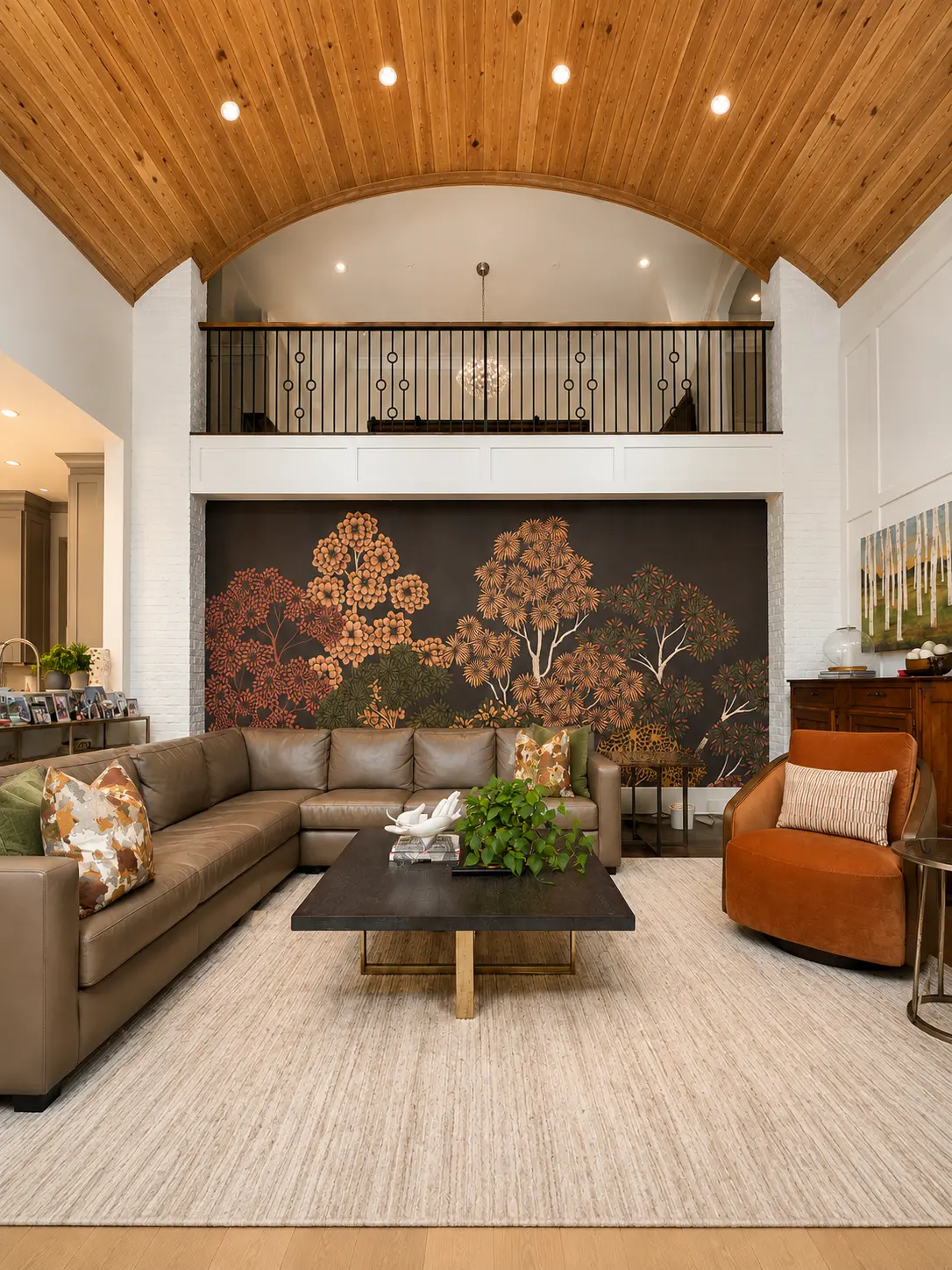 Dark botanical tree mural installation on a two-story living room wall in Sandy Springs GA
